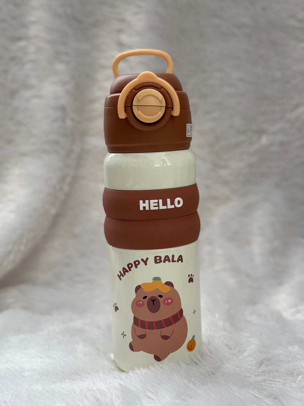 "Hello" series stainless steel vacuum-insulated water bottles 600 ml featuring cute cartoon character graphics and colorful silicone grip bands.
